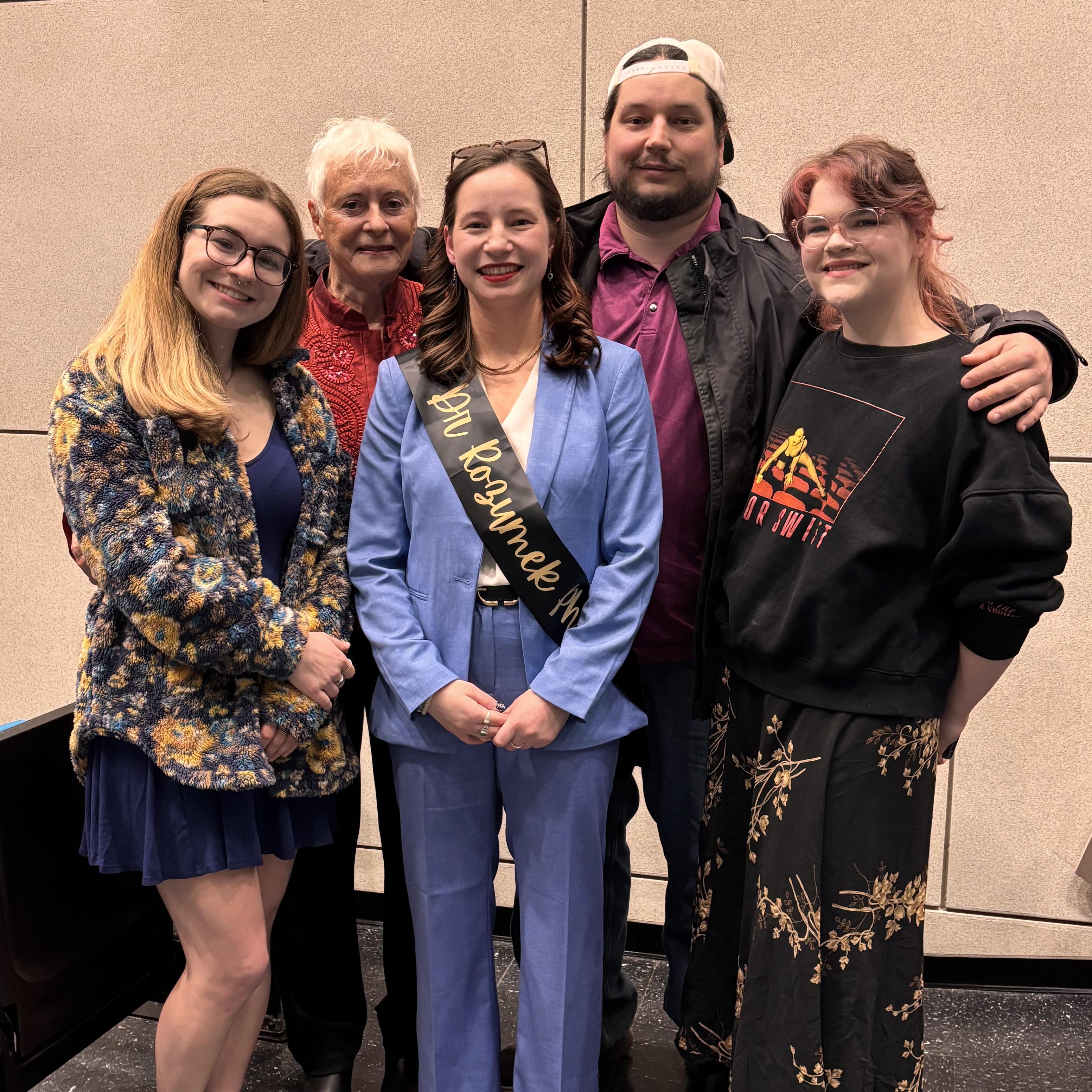 Gabrielle Rozumek with her family following her defense.